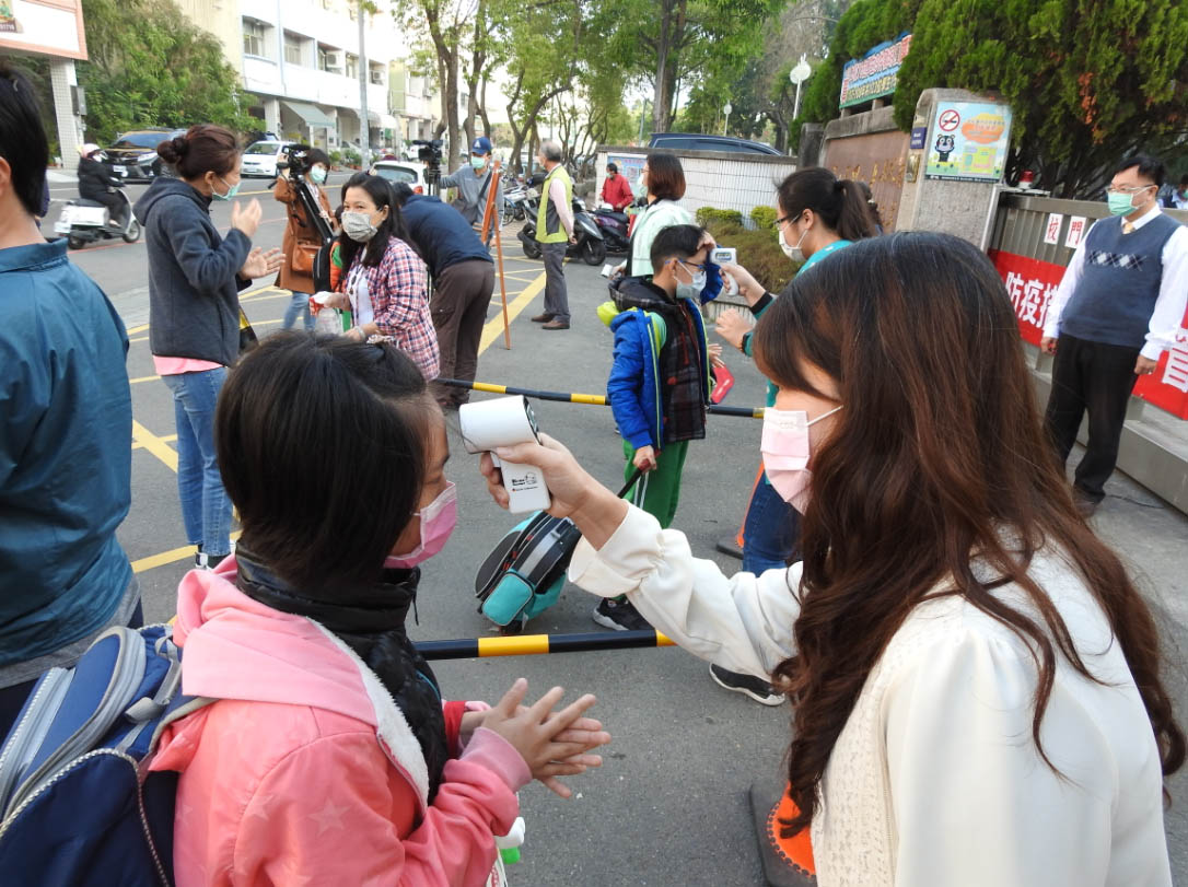 other image1-On the first day of the school term, Magistrate Lin takes school children’s temperature and taught them correct handwashing procedures (Feb. 25)