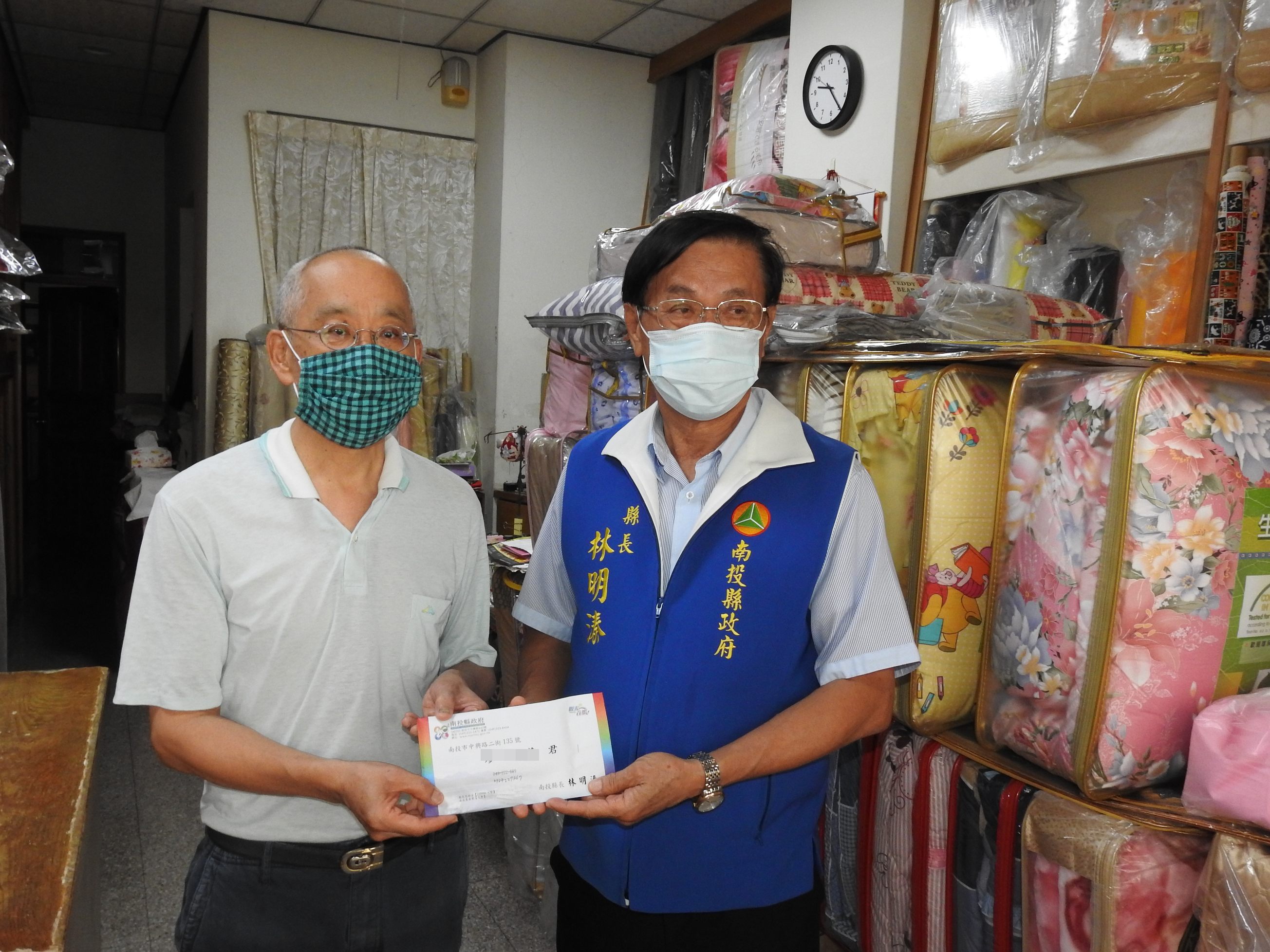 other image2-A relief program for COVID-19 is initiated and County Magistrate Lin presents relief payments in person, June 25