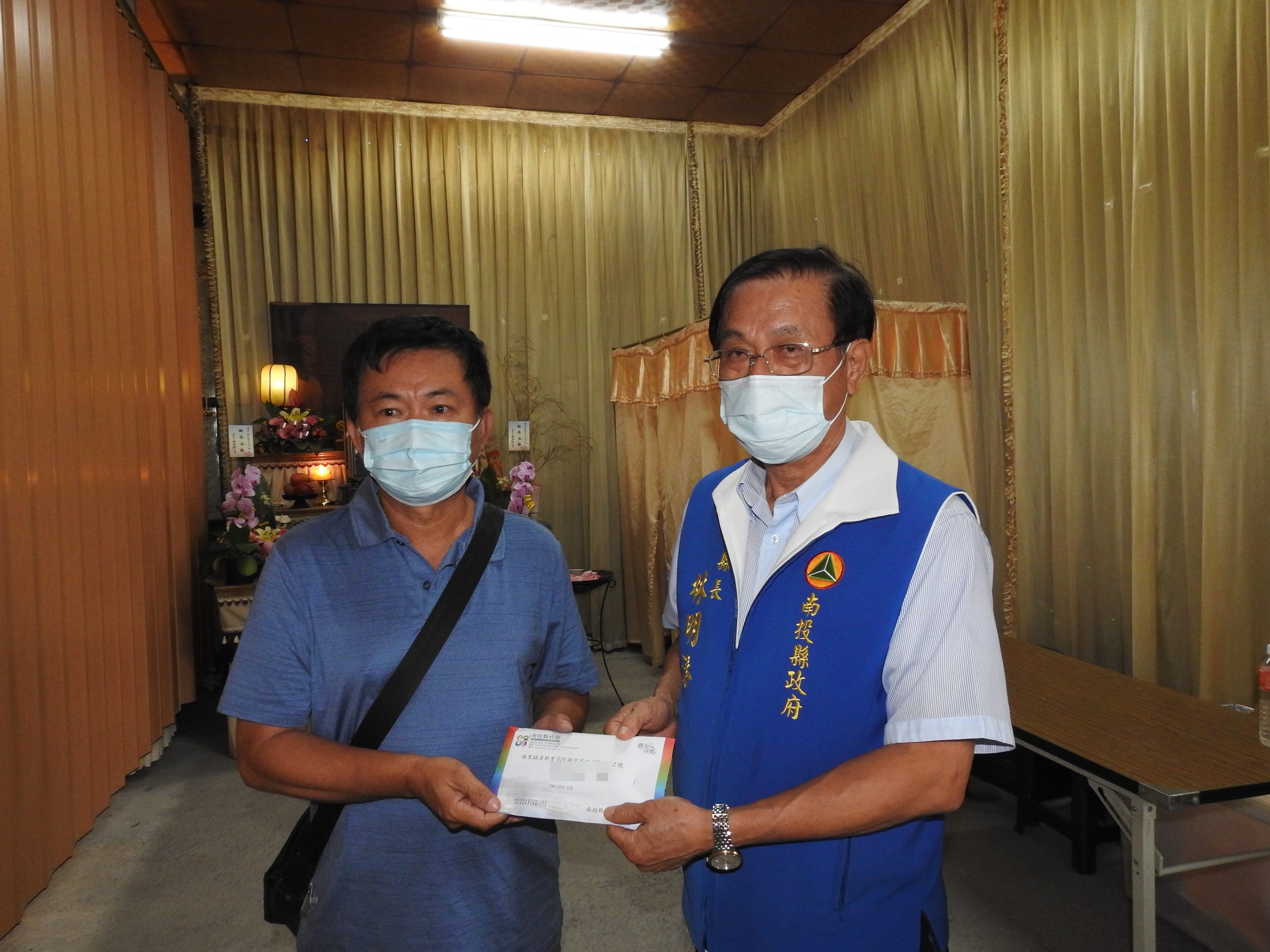 other image3-A relief program for COVID-19 is initiated and County Magistrate Lin presents relief payments in person, June 25